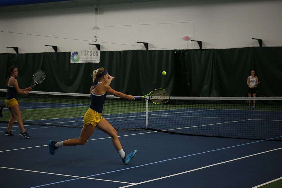 In+this+picture+from+staff+files%2C+Alexa+Brooks%2C+right%2C+and+Emma+Barnd%2C+left%2C+face+their+opponents+at+the+John+%26+Fay+Menard+YMCA+Tennis+Center+during+a+meet-up+with+UW-Stevens+Point+and+UW-Oshkosh+on+Oct.+12+and+13.+