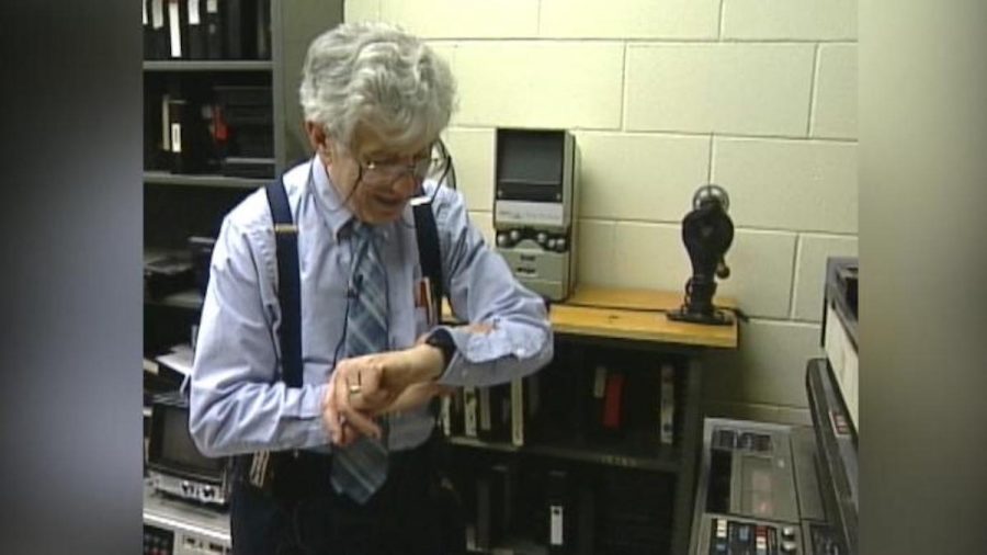 Professor Henry Lippold checking his watch.