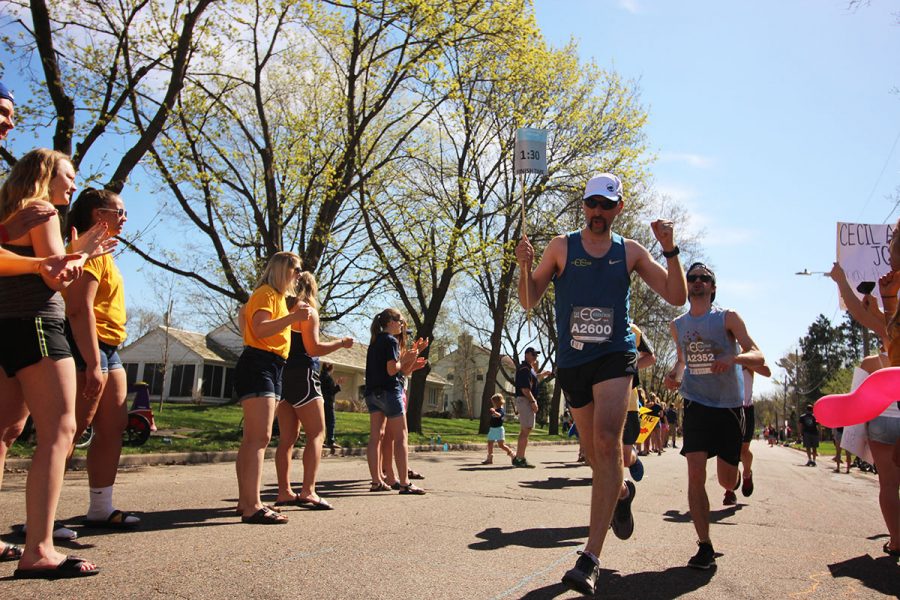 In this picture from staff files, a marathon pacer passes through the Blugold Mile during last springs Eau Claire Marathon. 