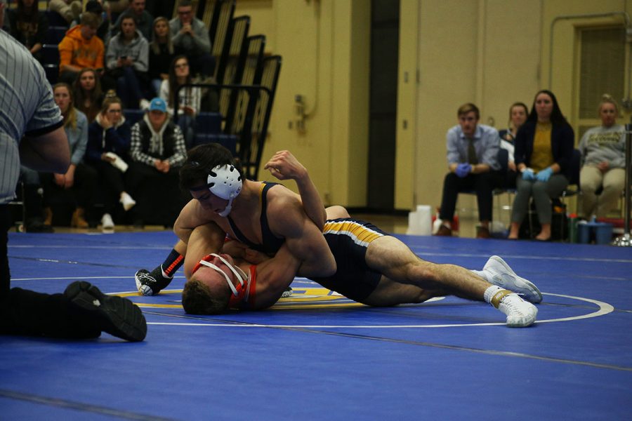  The crowd looks on as a Blugold wrestler takes on UW-Platteville. Next, the Blugolds will wrestle in a dual meet against UW-Stevens Point on Dec. 12.