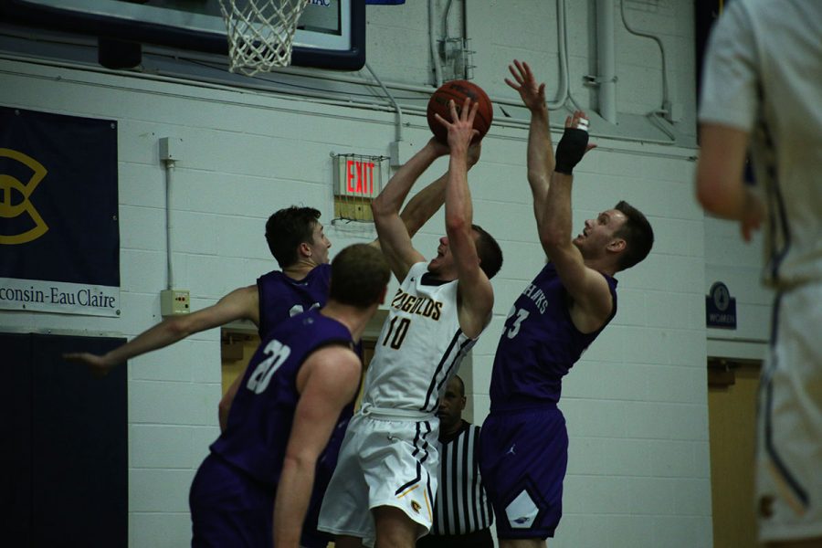 Fourth-year guard Ben Widdes fights to make a layup Saturday at Zorn Arena.