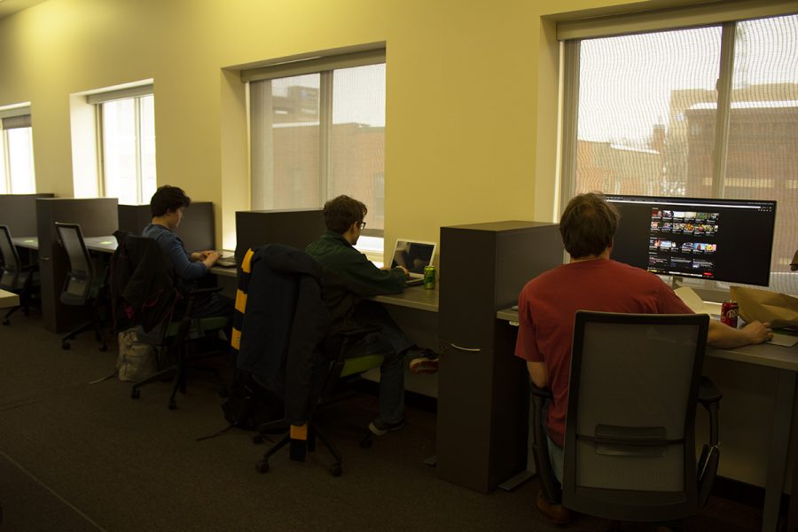 Clearwater Labs employees, including Alex Stout, co-founder and director and technical manager (far right), work in their new downtown office space at CoLAB, which is across from the Micon Downtown Cinema.