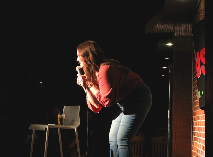  Brittany Tilander interacts with the audience while she tells jokes and stories last Thursday at The Plus. 