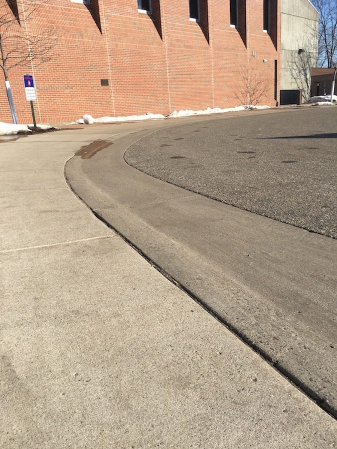 One example of universal design in action on campus is “curb cuts.” Curb cuts are the sloping edges of sidewalks that replace the traditional 90-degree-angled curbs.
