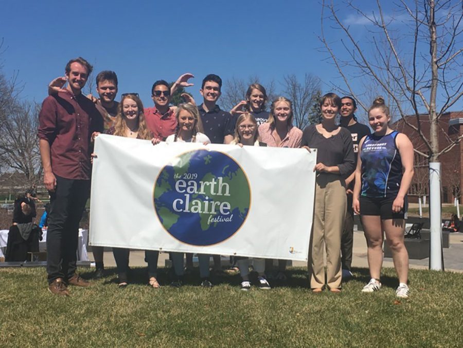 Austin Northagen, far left and former director of SOS and Lauren Becker, third from the right and new director of SOS pose with other members of SOS at the Earth Claire celebration on April 23. 