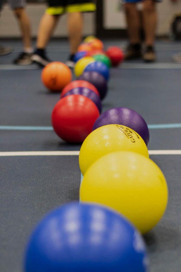 Dodgeballs are returned to the center line after each round.