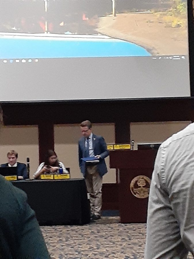 Charlie Johnson and Anna Ziebell, the president and vice president, respectively,  in discussion right after the meeting adjourned.