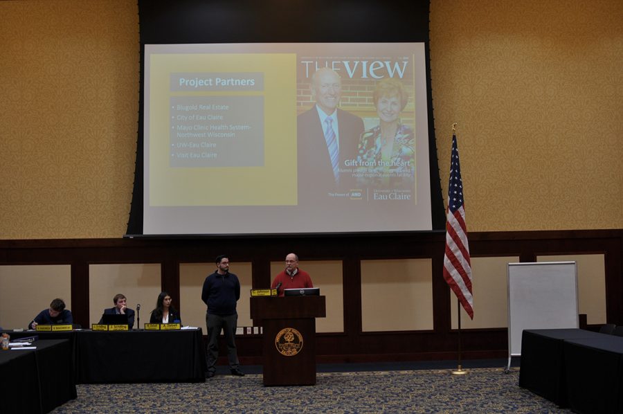 Mike Rindo, assistant chancellor for facilites and university relations, and Jacob Wrasse give a presentation.