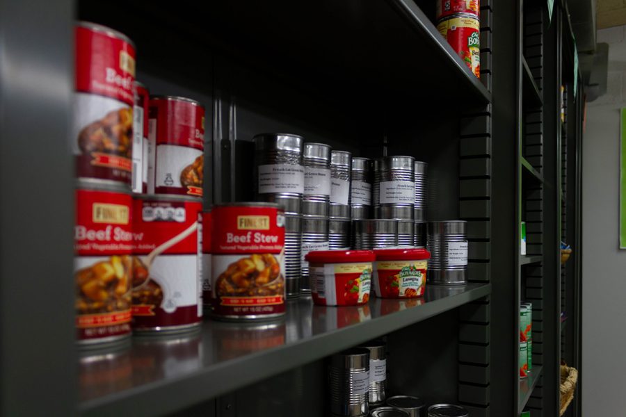 Cans of food on a shelf.