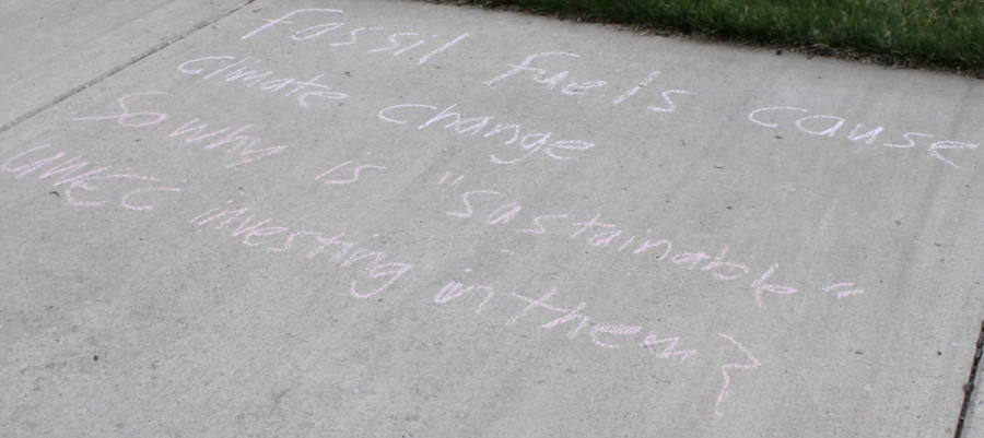 Before the Pedal to Divestment event on April 19, which was held by the UW Divestment Coalition, students wrote messages on campus sidewalks. This message reads, Fossil fuels cause climate change, so why is sustainable UWEC investing in them?