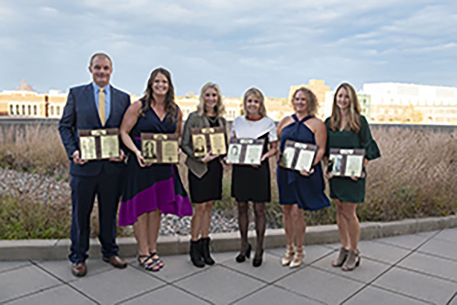 The 2021 Hall of Fame inductees pose with their plaques