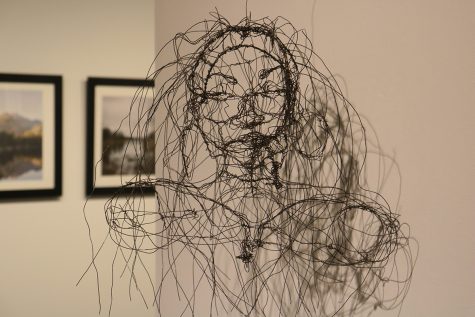 A black wire self portrait done by UWEC student Erin Phelps