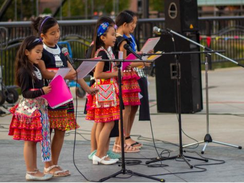 The market featured performers, such as this group of children who sang traditional Hmong songs.