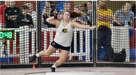 Fobbes performing in her star event, shot put, in the NCAA, Birmington, AL.