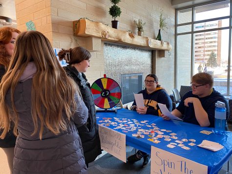 The Live Well Blugold L.L.C. from Murray Hall had a table for students to spin the wheel, answer a question about exercising and pick a sticker.
