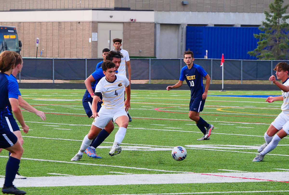 Second-year midfielder Jack Lewcock passes the ball to his teammate.