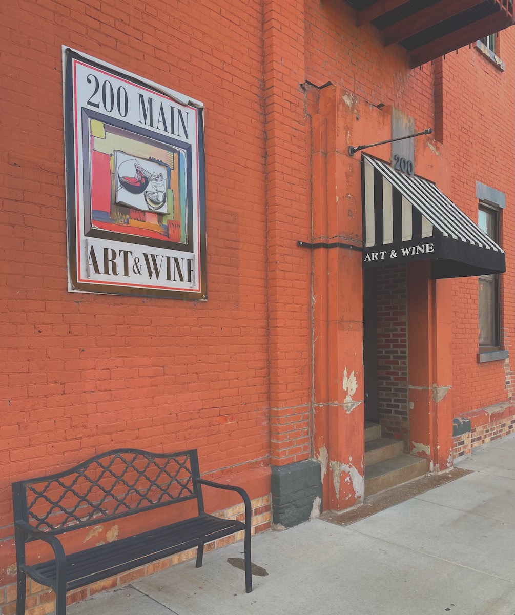 The warm exterior of 200 Main Art & Wine in downtown Eau Claire