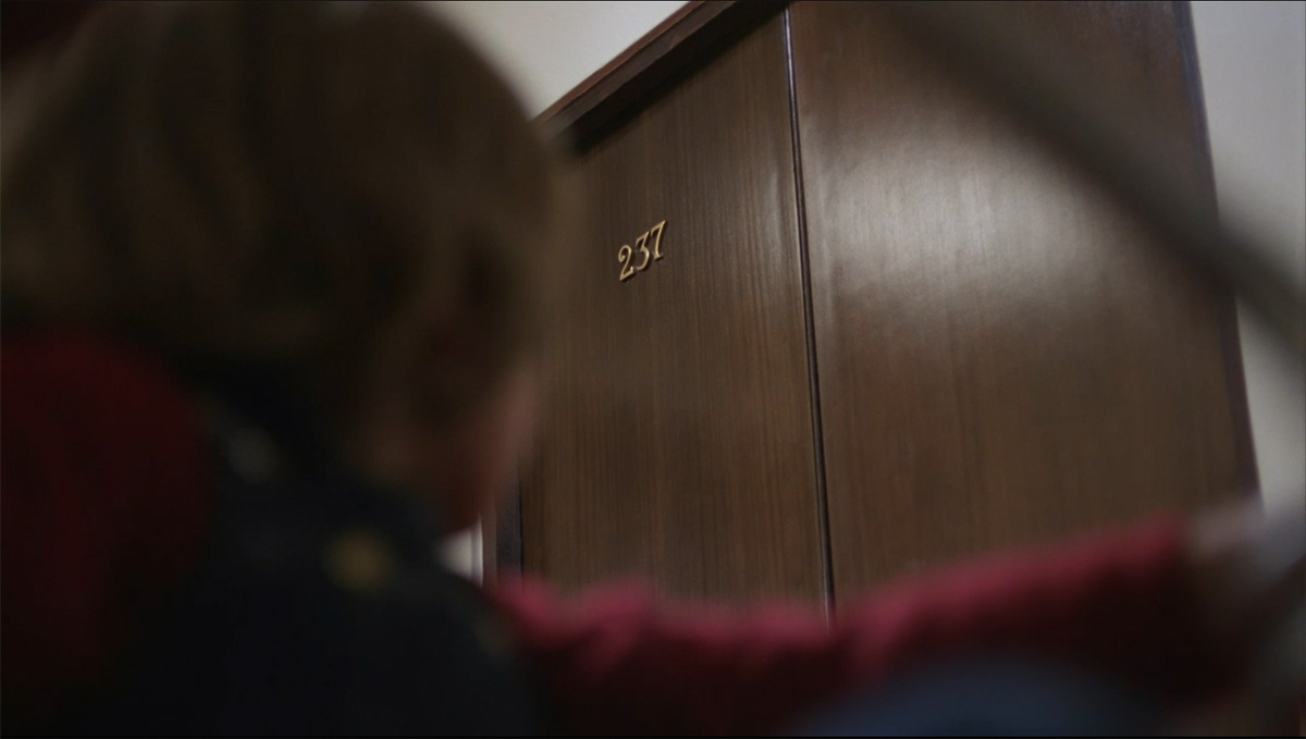 A still taken from “The Shining” as Danny wonders what is in Room 237.