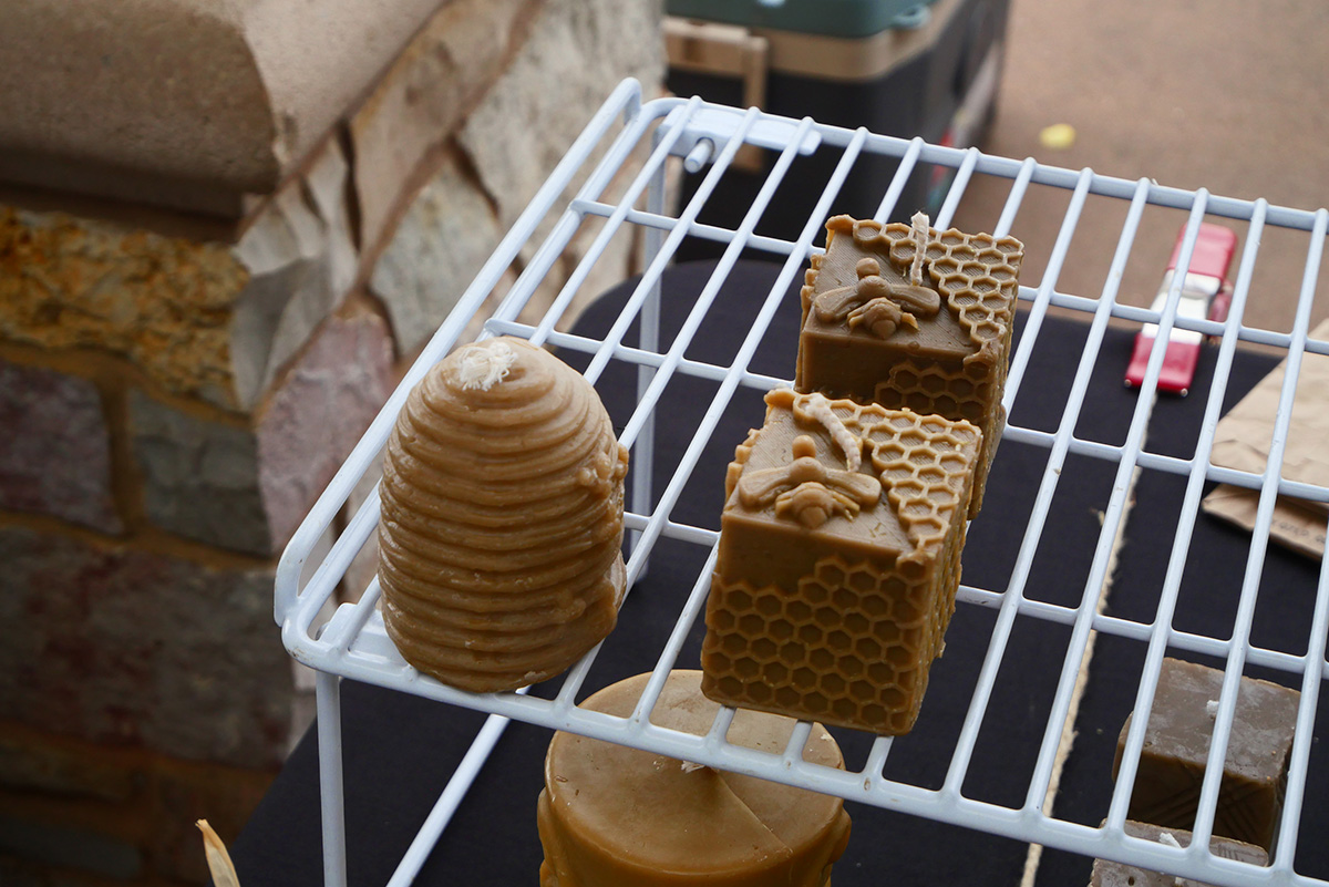 Handmade beeswax candles for sale at the Farmer’s Market.