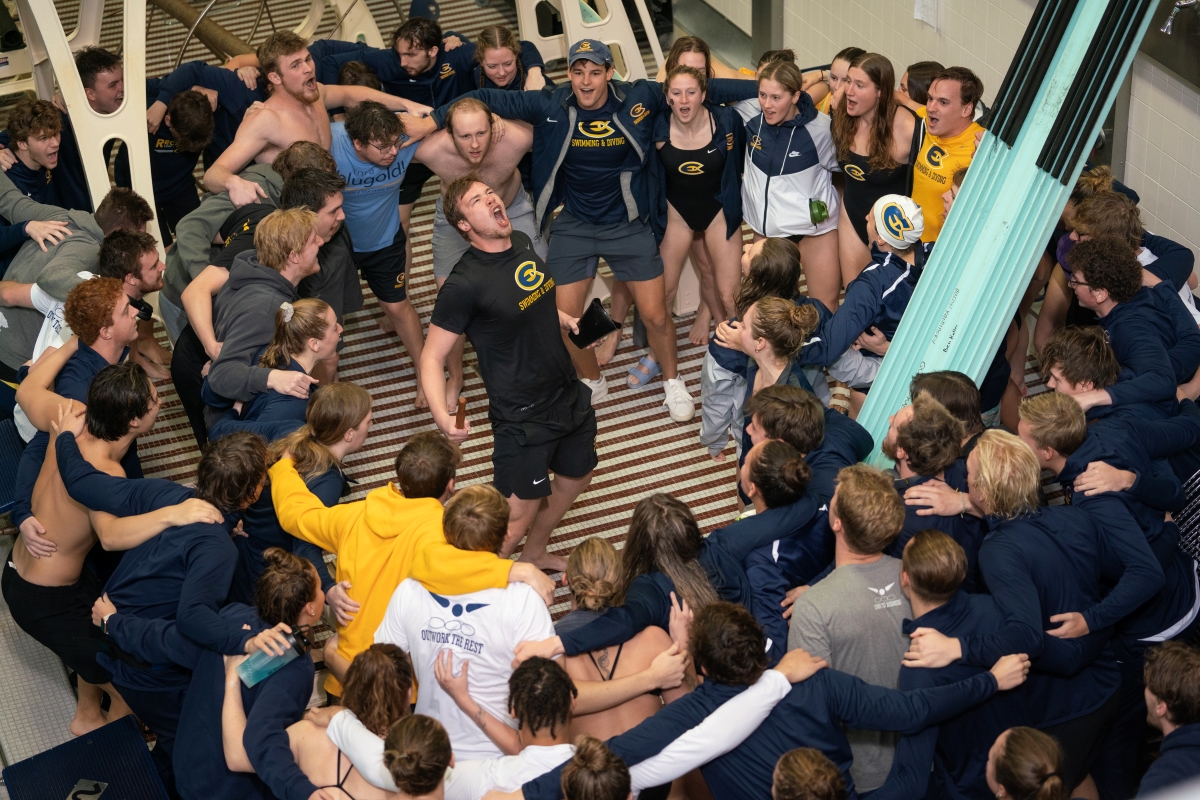 The swim and dive team celebrate the big win. (Shane Opatz, UWEC)
