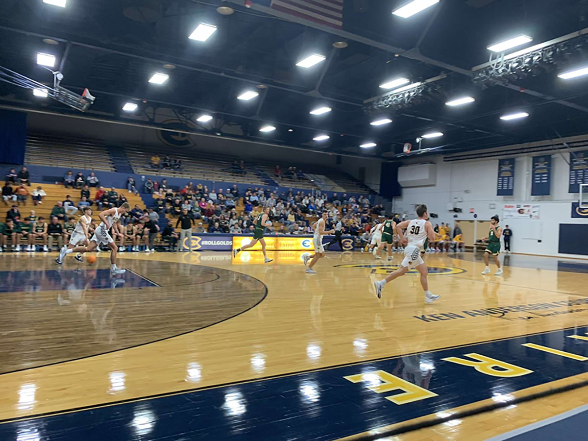UWEC driving the ball up the court.