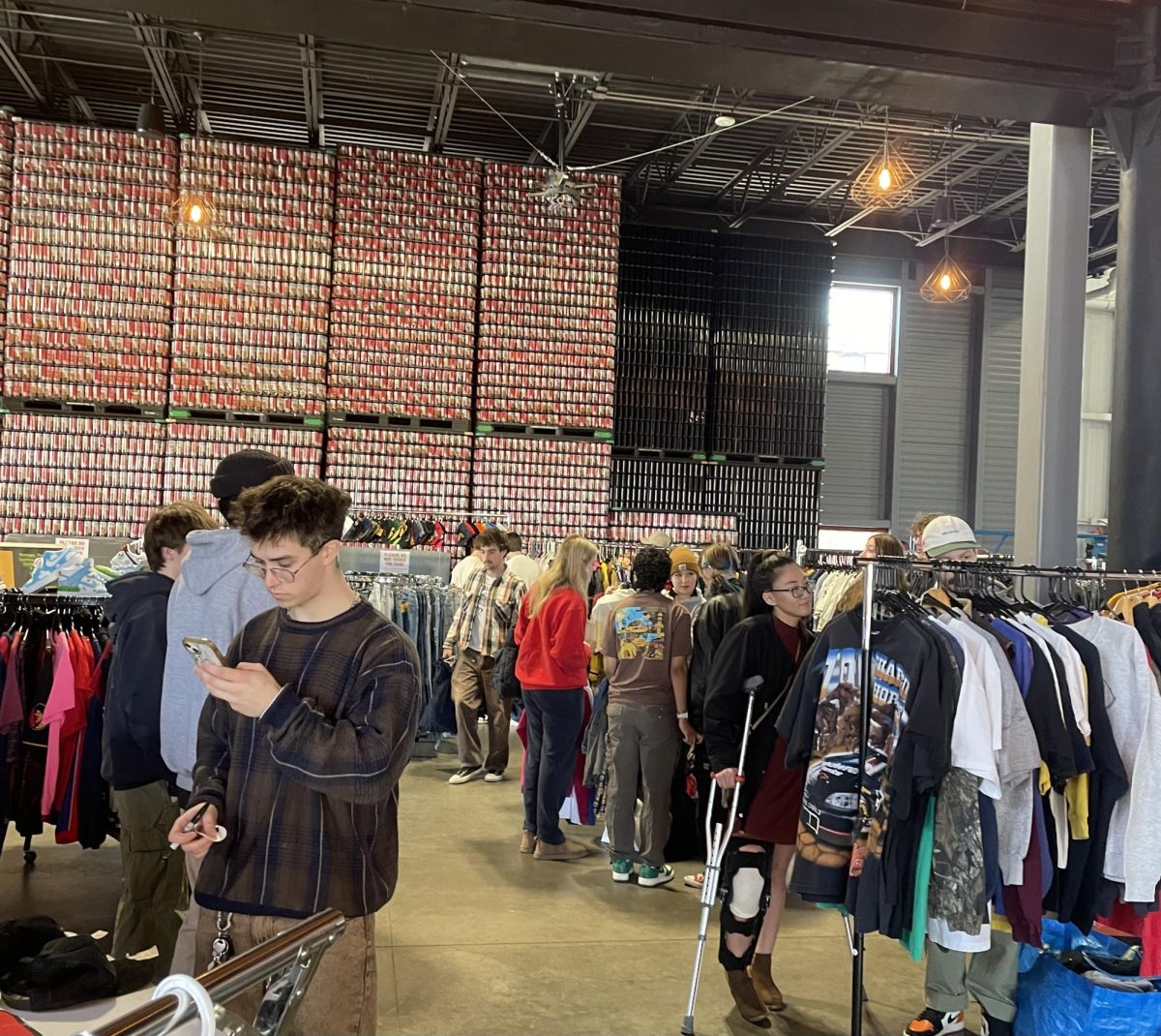 Patrons browse the racks of 715 Vintage Fest held at The Brewing Projekt.
