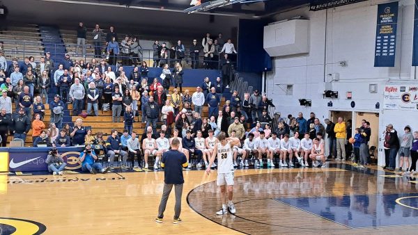 Coach Siverling honoring fourth-year Nolan Blair for senior night during both of their last game with UW-Eau Claire mens basketball. 