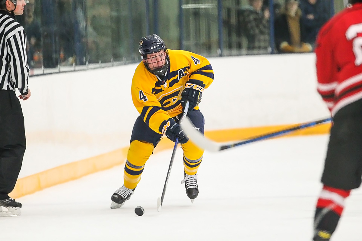 Fourth year, Sammy Martel controls the puck on the forecheck. 
Photo by Chico La Barbera, used with permission from UWEC Athletics.