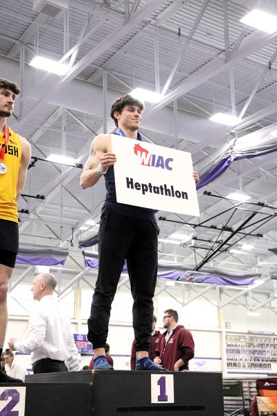 Max Foland stands atop the podium after coming in first overall at the heptathlon. Photo by Autumn Krause from UW-Whitewater Athletics used with permission