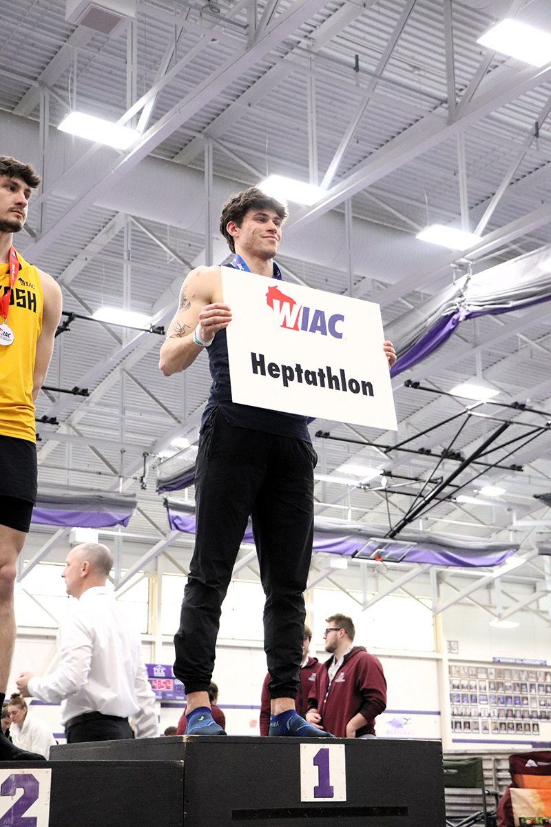 Max Foland stands atop the podium after coming in first overall at the heptathlon. Photo by Autumn Krause from UW-Whitewater Athletics used with permission