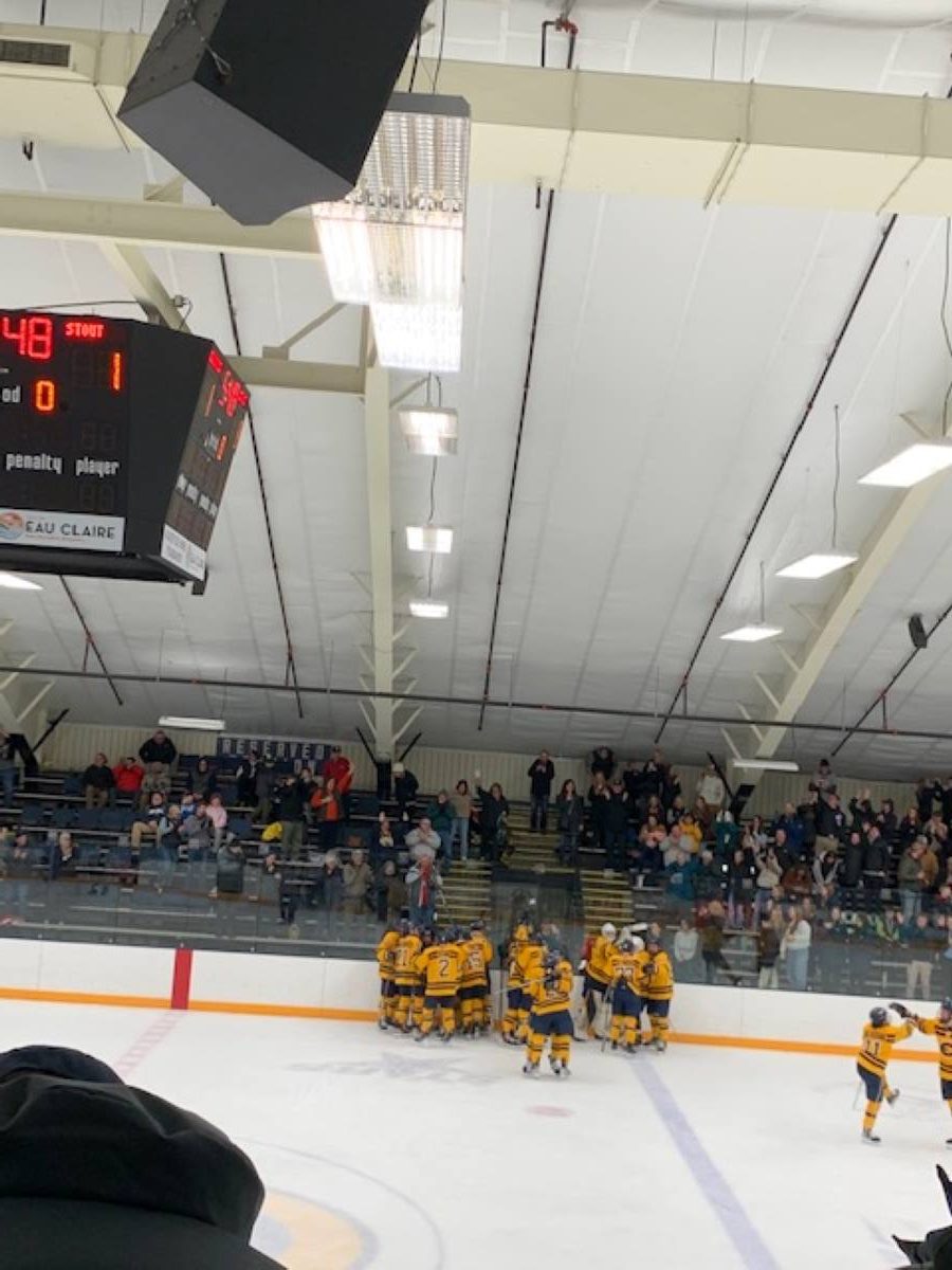 Blugolds celebrate the overtime winner.