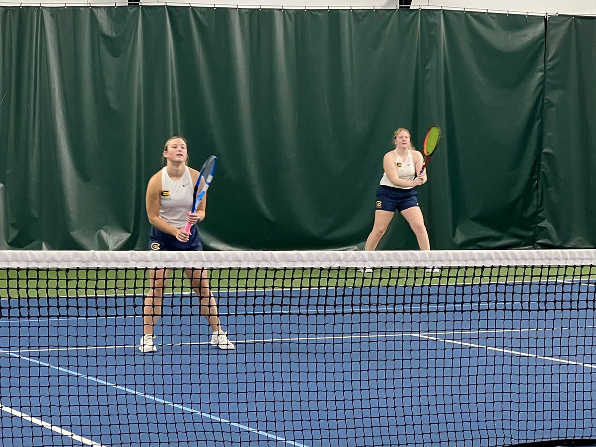 Addy Farber and Hailey Beisel receive a serve from the Bethel Royals.
