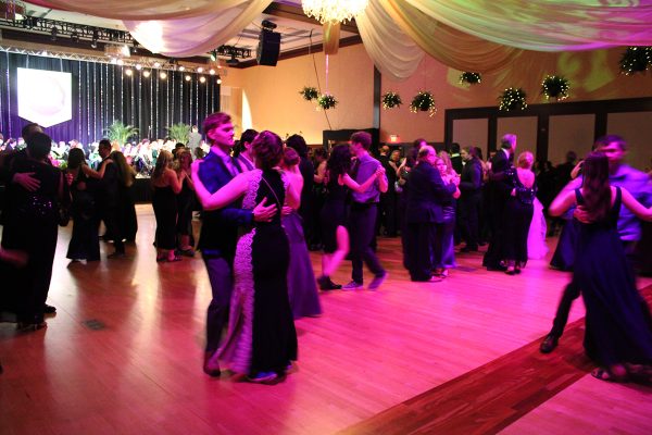Attendees dance the night away with the University Symphony Orchestra performing in the background.