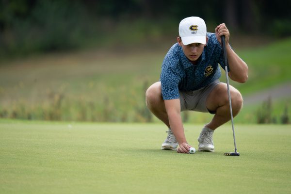 Amtmann locking to to the putt and reading the putt.
Photo by Bill Hoepner from UWEC Photo used with permission.

