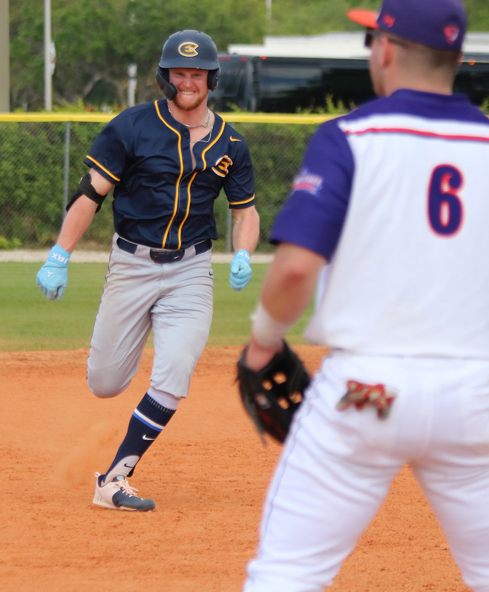 Jacob Lacy hustles to make it to third base safely.
Photo by Spencer Flaten from UWEC Sports Information used with permission.