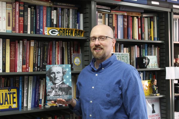 Eric Kasper poses with his recently published book.