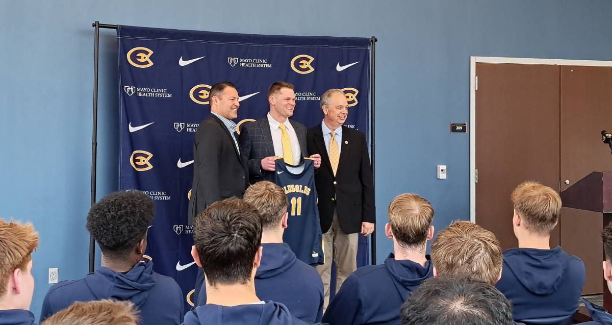 Director of Athletics Jason Verdugo (left) along with Chancellor James Schmidt (right) introducing Zach Malvik as the new head coach for men’s basketball.