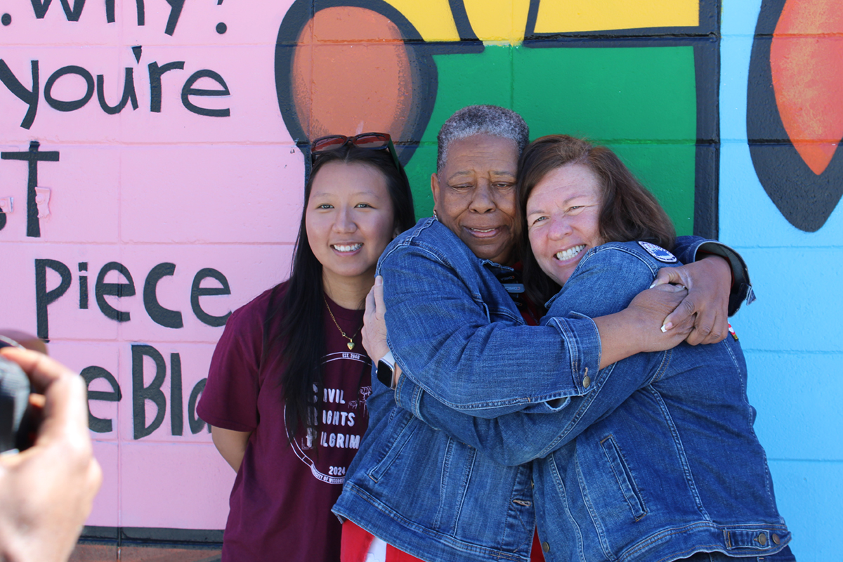 Through the Civil Rights Pilgrimage, Jodi-Thesing Ritter has fostered relationships with several activists from the Civil Rights Movement. Ritter (right) posing in front of a mural at the Foot Soldiers Park in Selma, Alabama with CRP student coordinator Chhime Yangdron (left) and civil rights activist Joanne Bland (center). 