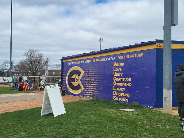 The dugout for the UW-Eau Claire’s womens softball team.  From left to right: “HONOR THE PAST, PERFORM IN THE PRESENT, PREPARE FOR THE FUTURE.” From top to bottom: “BELIEF. LOVE. UNITY. GRATITUDE. OWNERSHIP. LEGACY. DISCIPLINE. SELFLESS.”