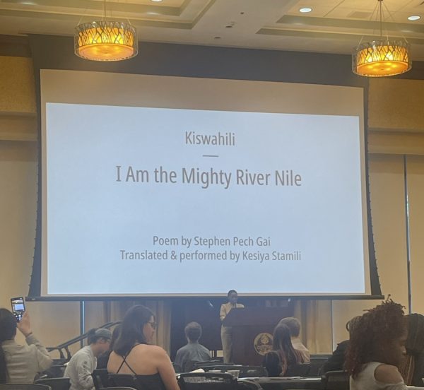  Kesiya Stamili reads “I Am The Mighty River Nile” in Kiswahili at the International Poetry Reading