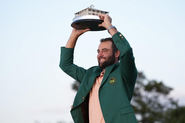 Scheffler hosts up the Masters Trophy and sports the green jacket.
Credit: Matt Slocum / AP Photo
