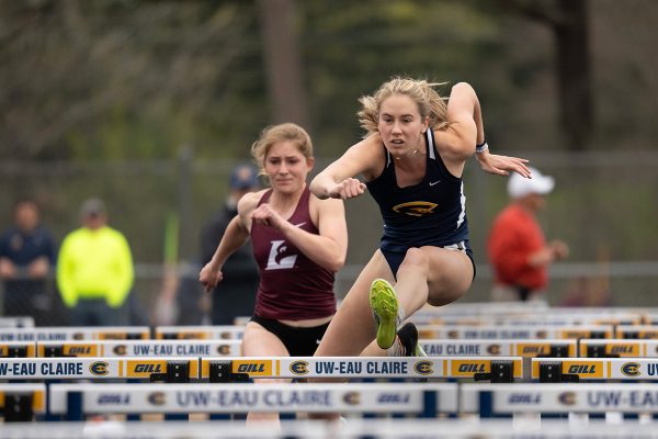 UW-Eau Claire athlete Jaryn Johannsen jumps over the hurdle.
Photo by Shane Opatz from UWEC Photography used with permission.