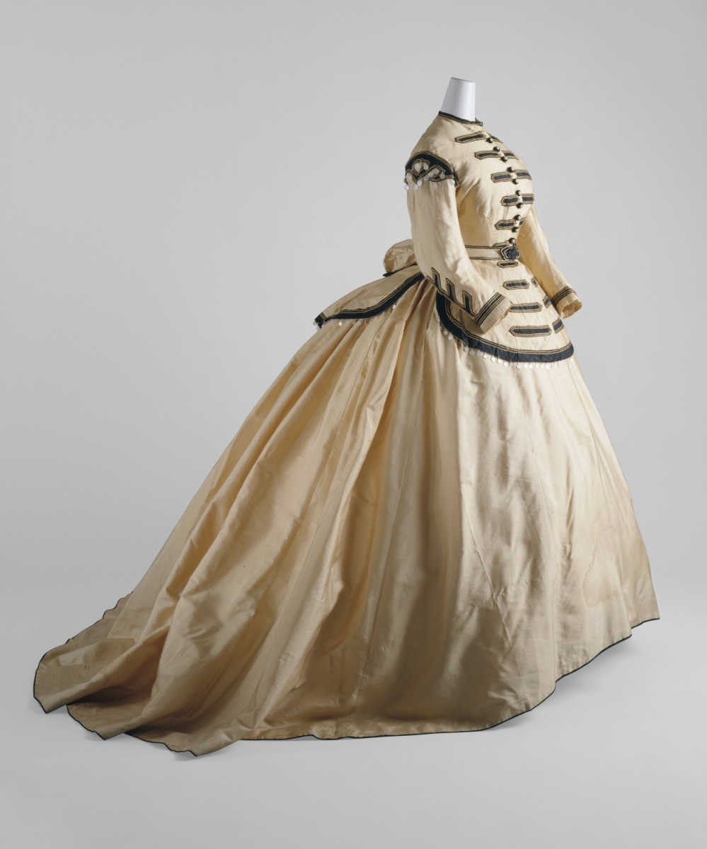 1760s fashion consisted of panniers and a fitted bodice, rather than the yellow silhouette of Disney’s Belle. (Photo from MET Museum, Public Domain)