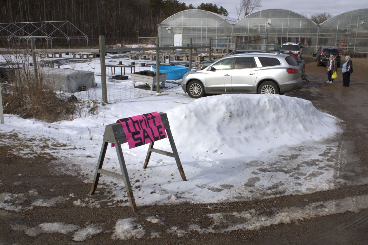 A sign welcomed shoppers to the Raintree Garden Center for a benefit thrift sale. 

