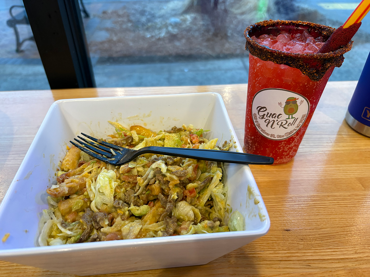 A fruit punch “JarriLoco” sits alongside the mystical Barstow Bowl at Guac N’ Roll in Downtown Eau Claire.