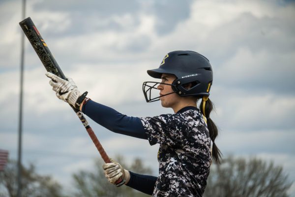 Norah Kutnick, #1 holding up her bat in preparation for her net at bat. (Picture used with permission from UWEC Sports Information)

